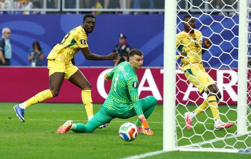Derrick Luckassen sends the ball past Croatia's goalkeeper Dominik Livakovic to draw Ghana level in the match on his international debut.