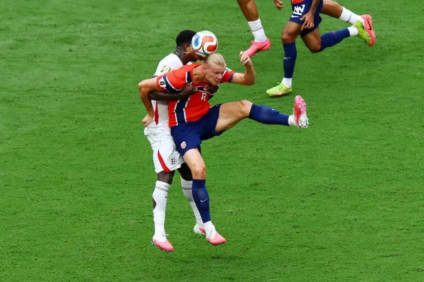 Norway's Erling Haaland is challenged by England's Marc Guehi