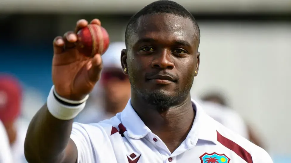 West Indies fast bowler Jayden Seales holds up the ball to celebrate taking five wickets against Pakistan